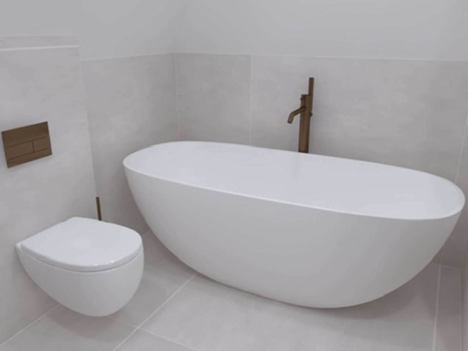 Vrijstaand bad met wandtoilet en bronzen kraan